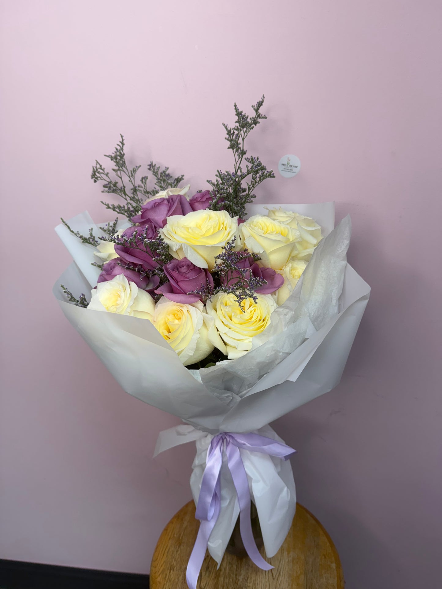 Candelight in purple bouquet