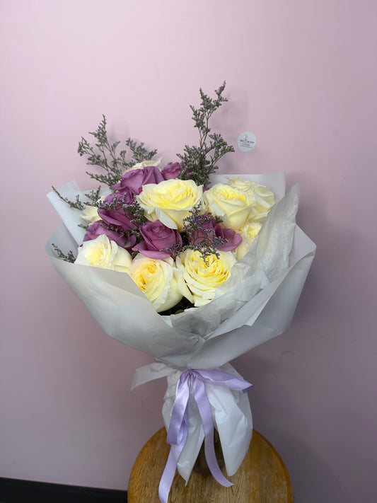 Candelight in purple bouquet